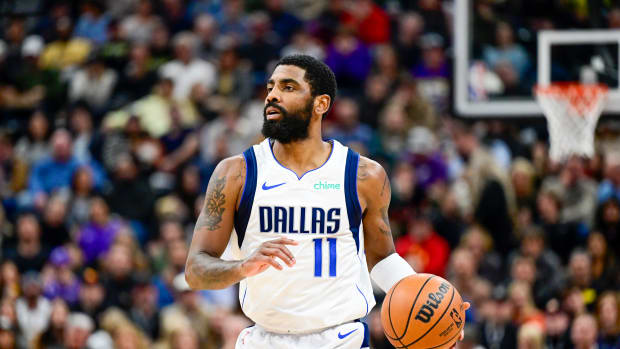 Dallas Mavericks guard Kyrie Irving dribbles the ball against the Utah Jazz.